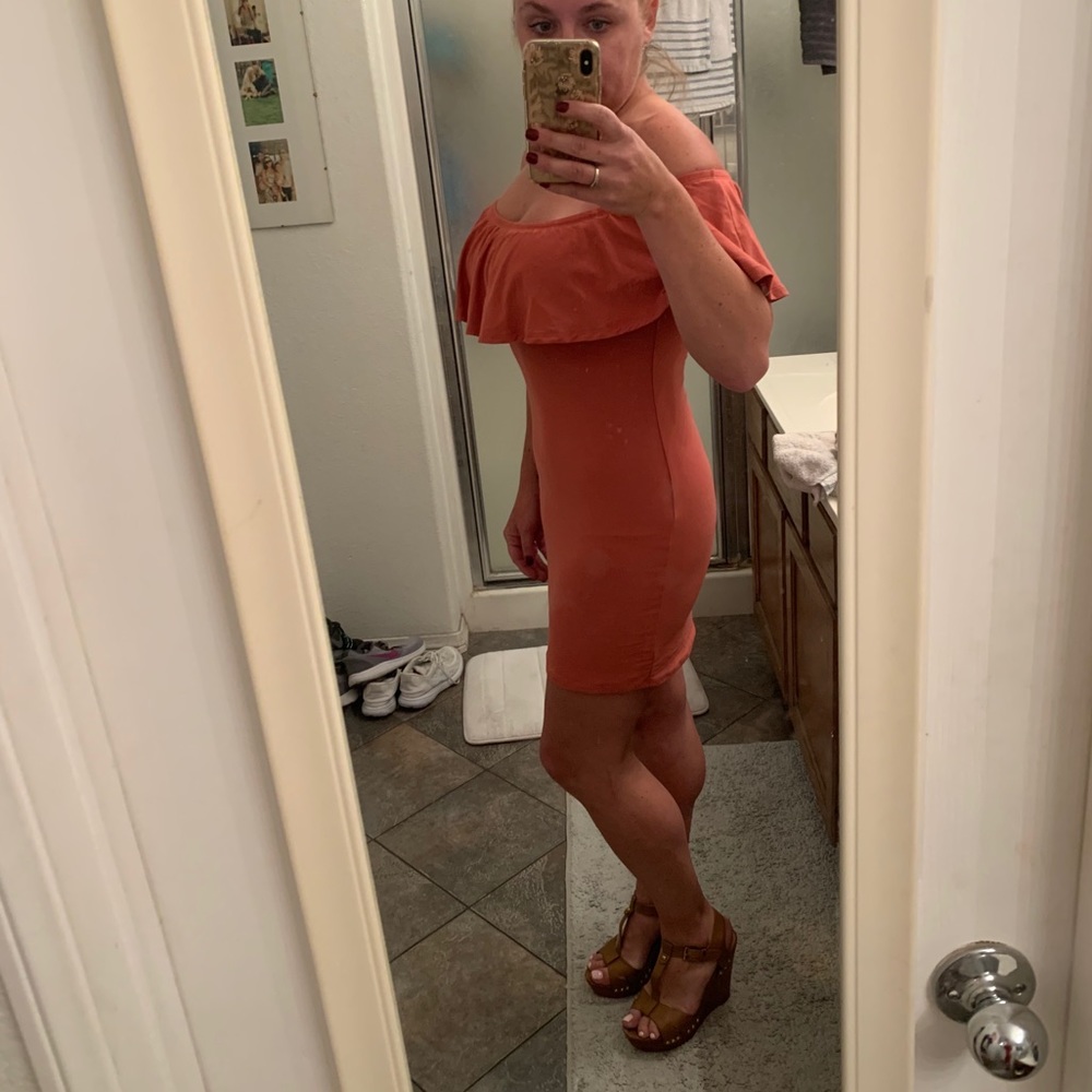 Rose-pink, form-fitting, off-the-shoulder dress